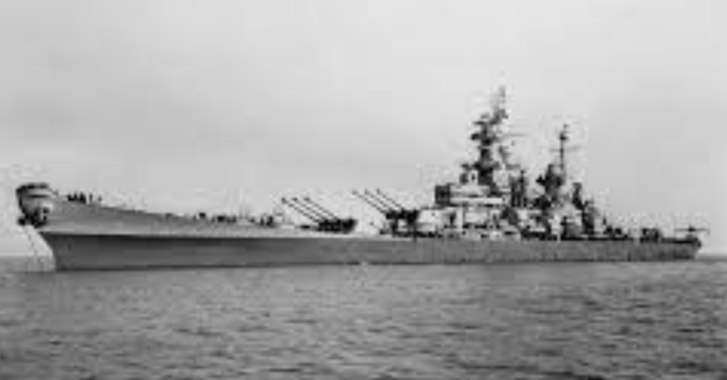 
A historical black and white image of the Battleship USS IOWA while under way.