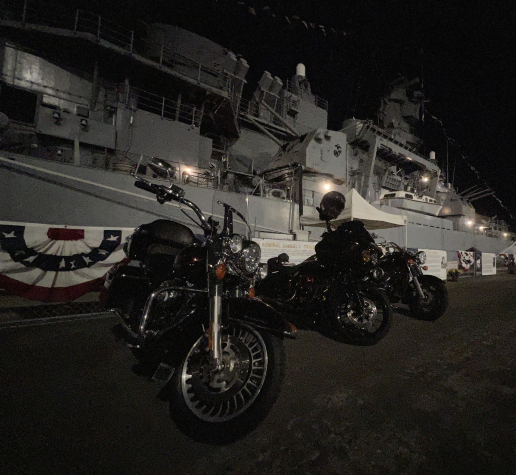 Area 4 motorcycles parked in front the battleship USS IOWA